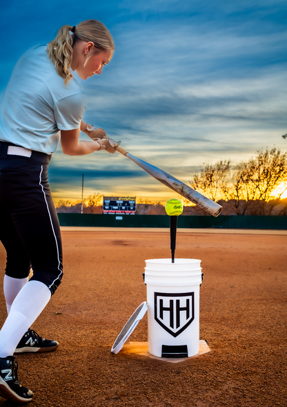 Softball player hitting ball off of Home Run Hero tee