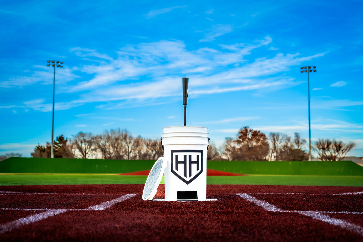 Home Run Hero bucket and tee sitting on home plate