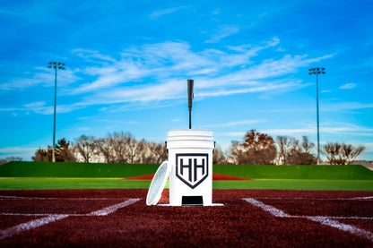 Home Run Hero bucket and tee sitting on home plate