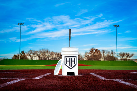 Home Run Hero bucket and tee sitting on home plate