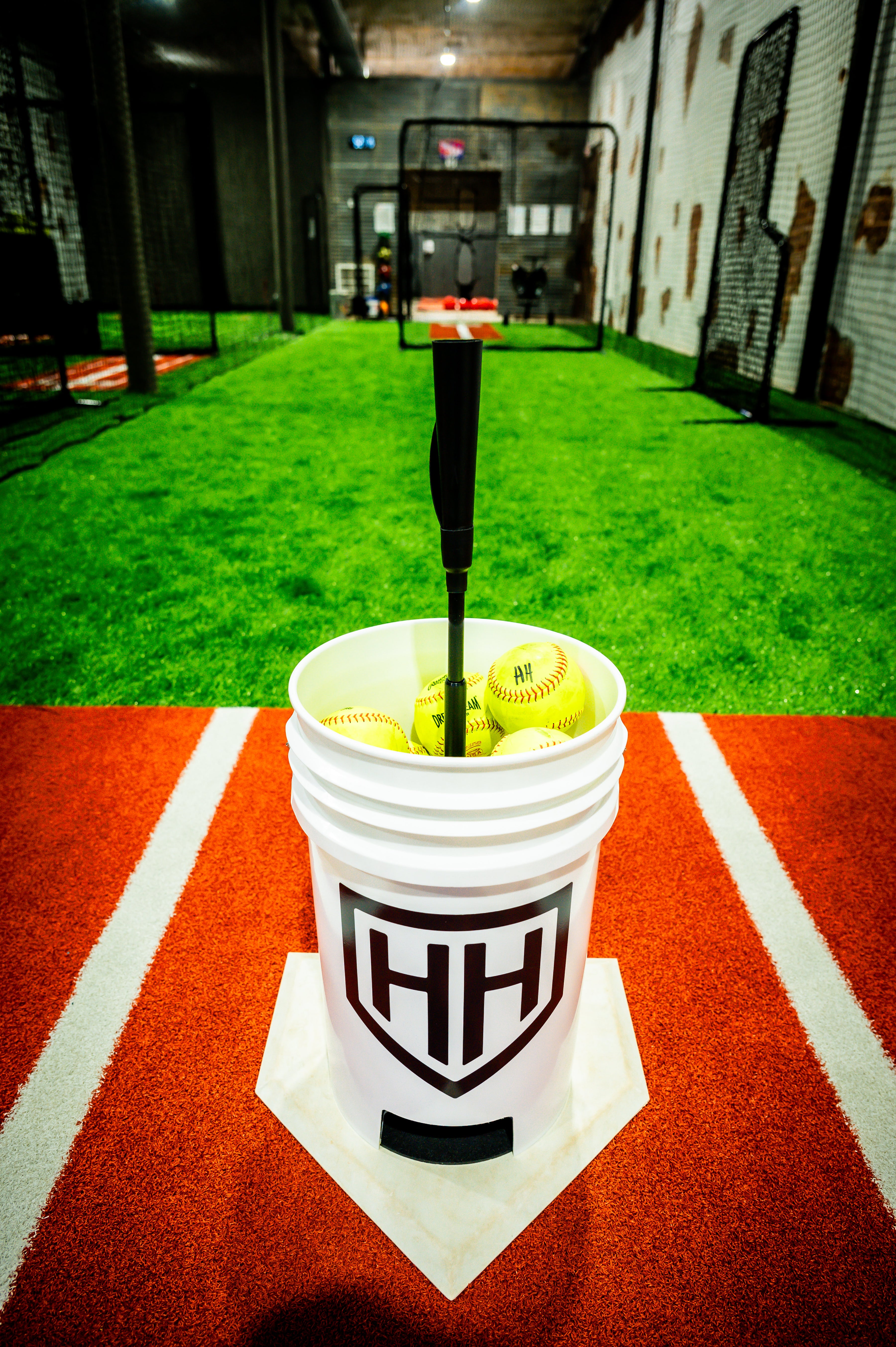 Home Run Hero ball bucket full of softballs